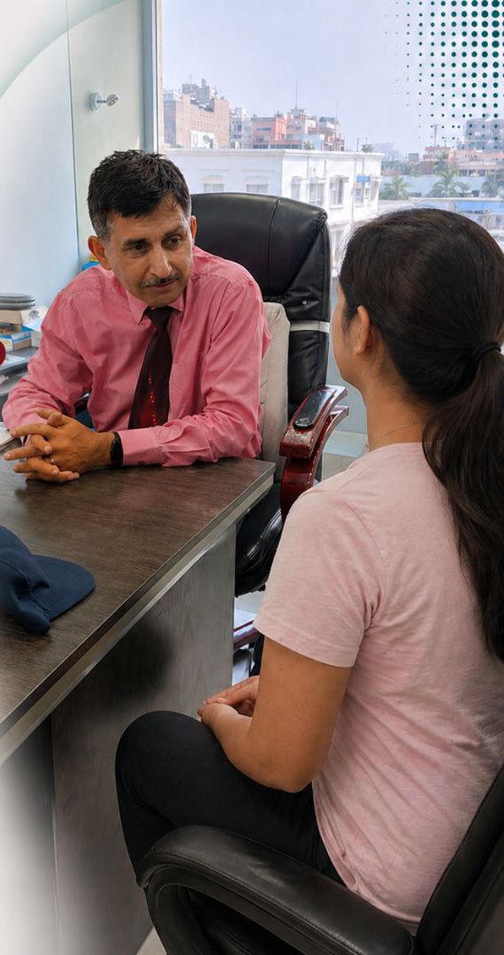 Dr Manoj Khanna consulting with a liposuction patient